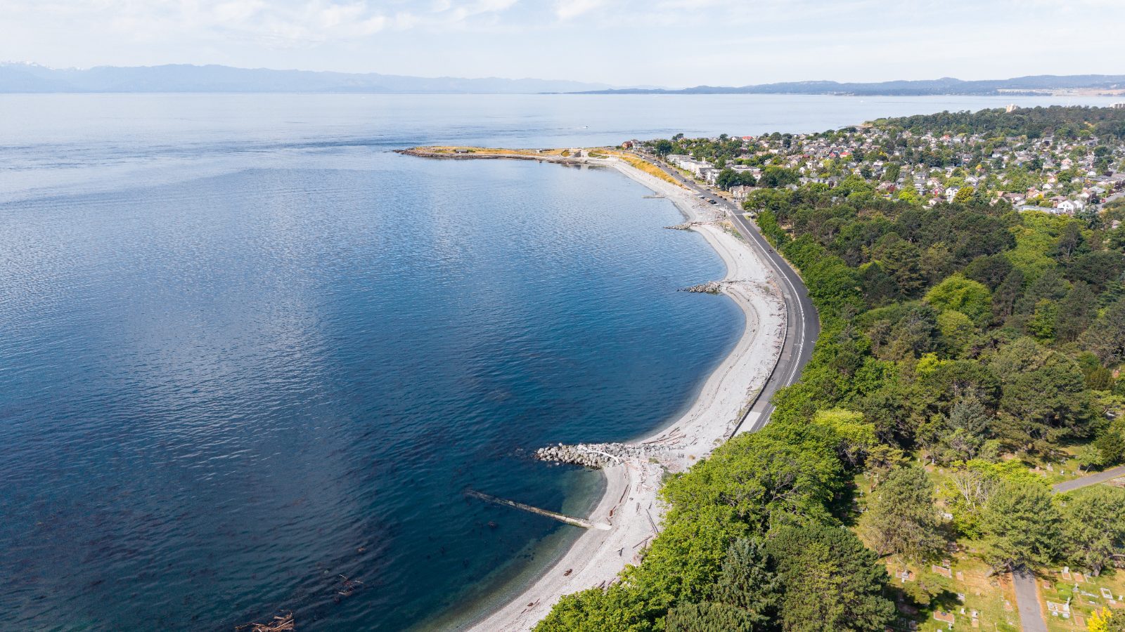 Aerial view of the Ross Bay and Clover Point coastline along Dallas Road in Victoria BC